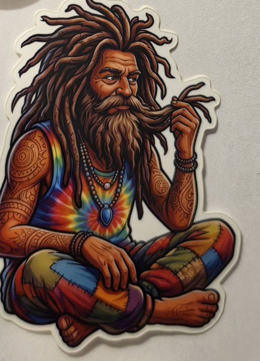 Kyle the Wook die-cut vinyl sticker — tattooed, dreadlocked wook sitting cross-legged, twirling his beard